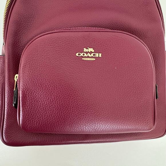 coach boysenberry backpack Court Crafted of Signature canvas and smooth leather this backpack features an interior laptop sleeve inside pockets and an outside zip pocket for ample storage Coach Court Leather Backpack in